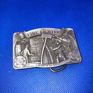 vintage "The Fire Fighter" belt buckle, likely made by C&J in the USA.